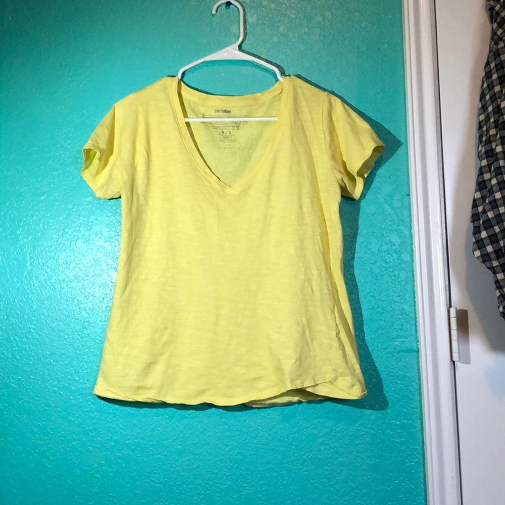 yellow v neck shirt